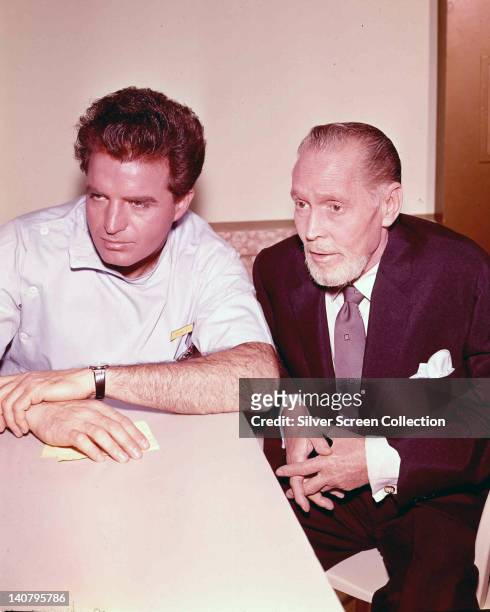 Vince Edwards , US actor, and Franchot Tone , US actor, in a publicity still issued for the US television series, 'Ben Casey', circa 1963. The...