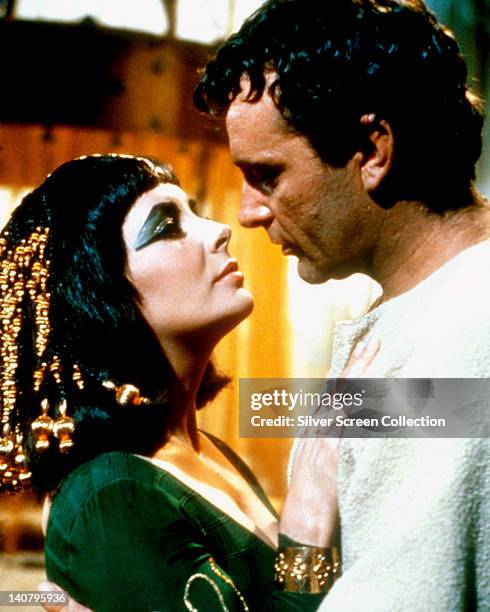 Elizabeth Taylor , British actress, and Richard Burton , British actor, both in costume in a passionate embrace in a publicity still issued for the...