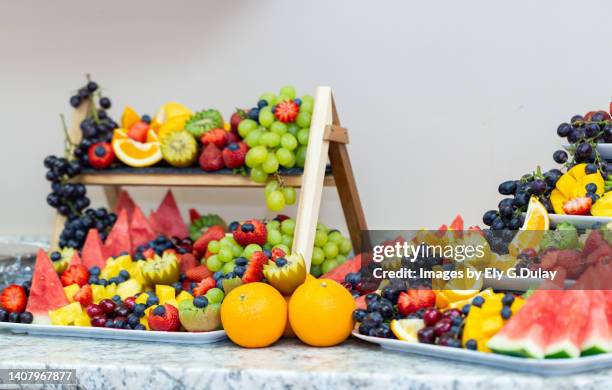 fruit  arrangement - fruchtzucker stock-fotos und bilder