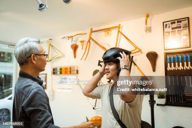 customer in bicycle store. - product life cycle stock pictures, royalty-free photos & images