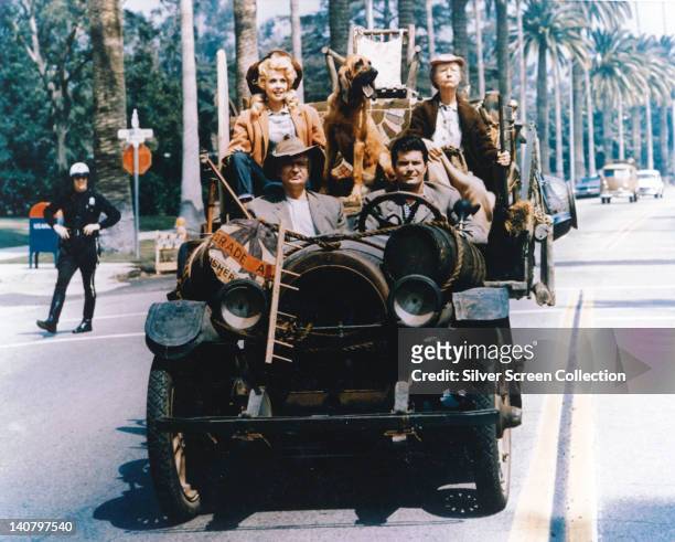 Donna Douglas, US actress, Irene Ryan , US actress, Max Baer Jr, US actor, and Buddy Ebsen driving in the family car in a publicity still issued for...