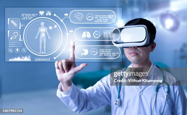 doctor analyzing  human body on technological digital futuristic virtual interface - bone graphic stock-fotos und bilder