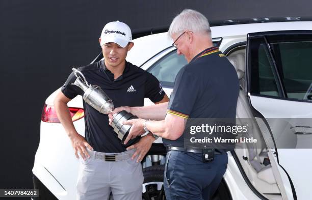 Collin Morikawa of The United States interacts with Martin Slumbers, CEO of the R&A during a practice round prior to The 150th Open at St Andrews Old...