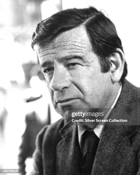 Headshot of Walter Matthau , US actor, wearing a tweed jacket over a white shirt and a dark tie, circa 1970.