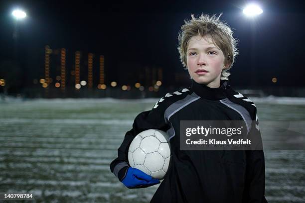 portrait of proud boy with football (soccer) - jugendfußball stock-fotos und bilder