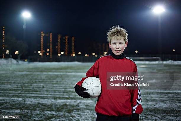 portrait of a boy with a football (soccer) - winter denmark stock pictures, royalty-free photos & images