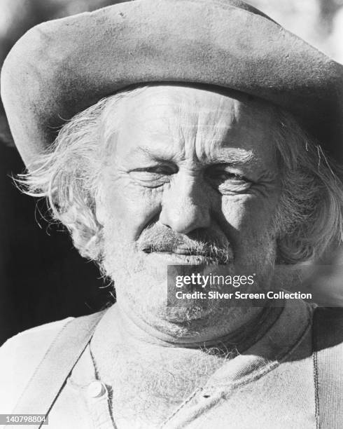 Headshot of Strother Martin , US actor, unshaven and wearing a hat with an upturned brim, circa 1975.