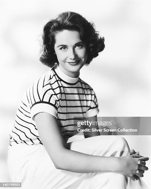 Virginia Maskell , British actress, wearing a white striped top, in a studio portrait, against a white background, circa 1960.