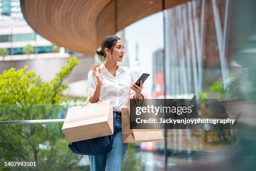 Portrait of a wealthy asian woman outside a luxury mall Portrait of a wealthy asian woman outside a luxury mall
