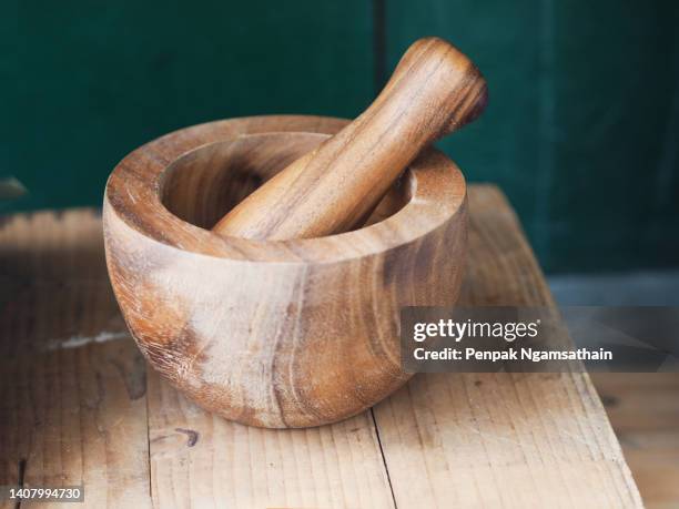 wooden mortar, kitchen implements for cook pound thoroughly - mortar and pestle stock pictures, royalty-free photos & images