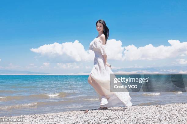 Wendy Yu, founder and president of Yu Holdings, poses for a photo on the shore of Qinghai Lake on July 3, 2022 in Xining, Qinghai Province of China.