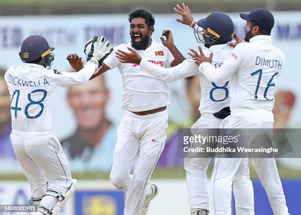 Prabath Jayasuriya of Sri Lanka celebrates with teammates after taking the wicket Steven Smith of Australia during day four of the Second Test in the...