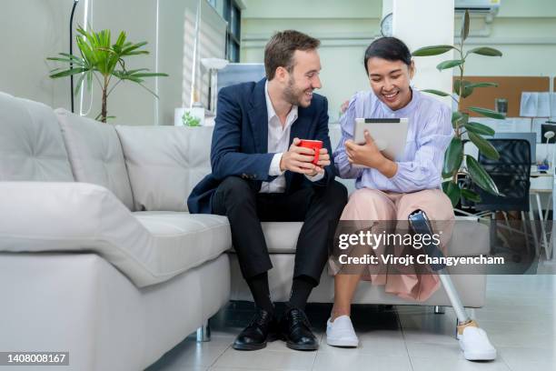 social equality concept, business colleagues in meeting with woman with artificial leg. - disability employment stock pictures, royalty-free photos & images