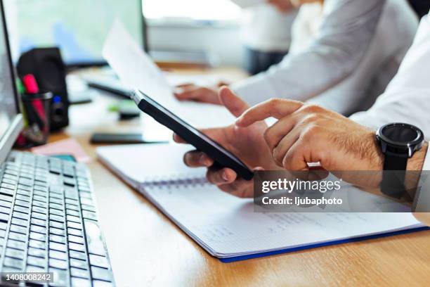 successful man using his smart phone - accounting services stock pictures, royalty-free photos & images