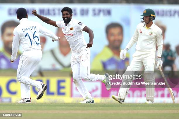 Prabath Jayasuriya of Sri Lanka celebrates with teammates after taking the wicket Cameron Green of Australia during day four of the Second Test in...