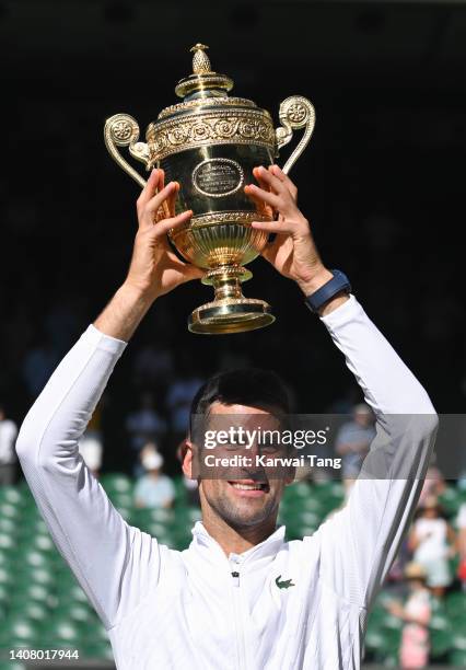 Novak Djokovic holds the Wimbledon Trophy after winning the Wimbledon Men's Singles Final at the All England Lawn Tennis and Croquet Club on July 10,...