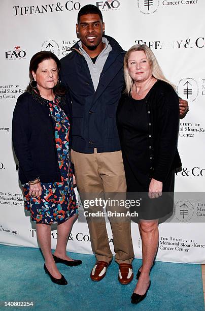 Anne Keating, NY Giants wide receiver Ramses Barden, and Courtney Arnot attends the 21st Annual Bunny Hop at FAO Schwarz on March 6, 2012 in New York...