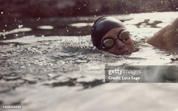 close up shot of female sea swimmer doing crawl in ibiza, spain. - sports personality of the year red carpet arrivals stockfoto's en -beelden