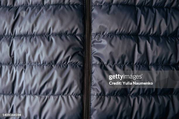puffer jacket texture. down jacket fabric background. background of urban winter outfit. - down feather stock pictures, royalty-free photos & images