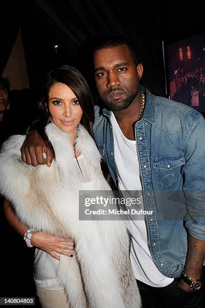 Kim Kardashian and Kanye West attend the Kanye West Ready-To-Wear Fall/Winter 2012 show as part of Paris Fashion Week at Halle Freyssinet on March 6,...