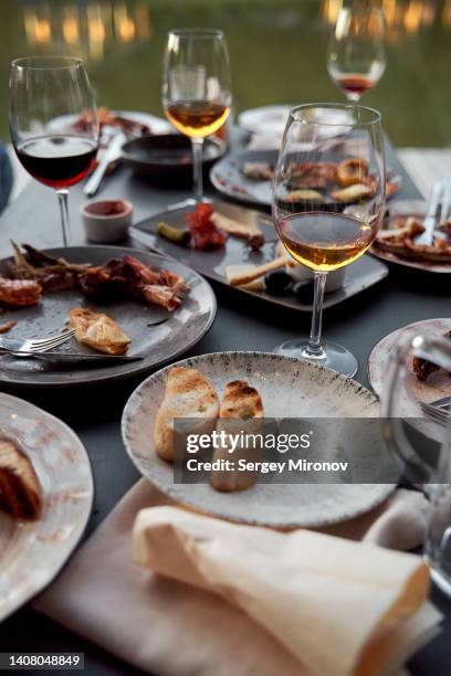 leftovers of outdoor dining table - al fresco dining stock pictures, royalty-free photos & images