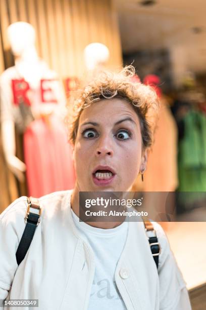 woman making a frightened face as a joke - freaky faces stock pictures, royalty-free photos & images