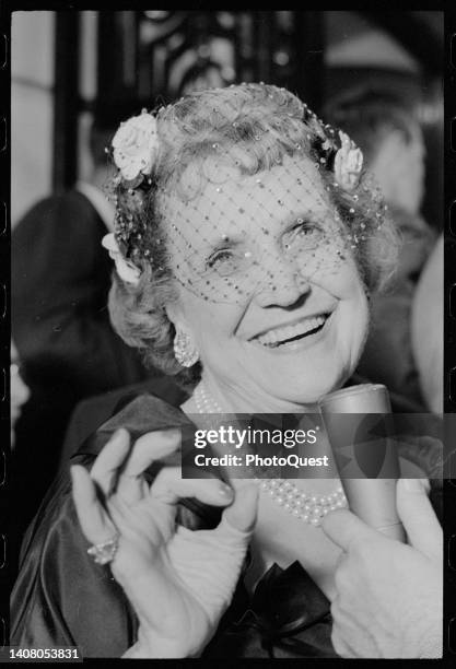 American socialite and former US Ambassador to Luxembourg Perle Mesta smiles as she is interviewed during a party at the Russian Embassy, Washington...