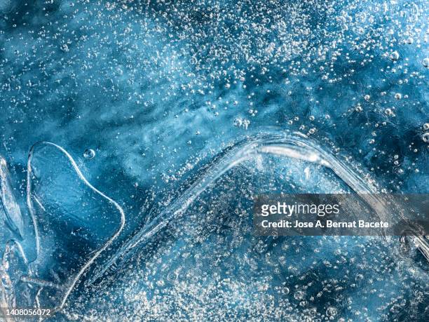 full frame of frozen water surface in a river in the form of ice. - glace texture imagens e fotografias de stock