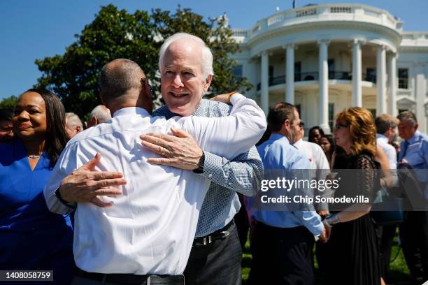 Fred Guttenberg, whose daughter Jamie was killed in the Majory Stoneman Douglass High school shooting, hugs Sen. John Cornyn during an event to...