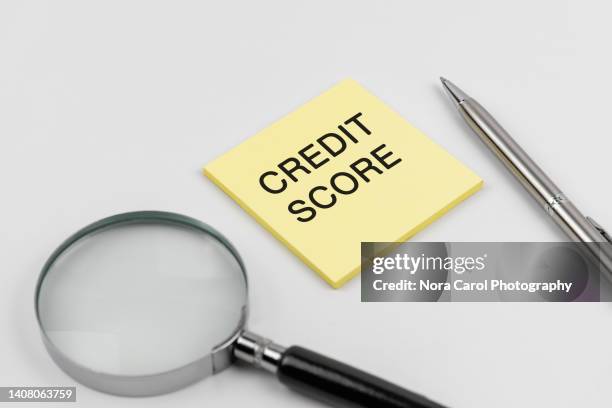 credit score text on adhesive note - credit scoring stock pictures, royalty-free photos & images