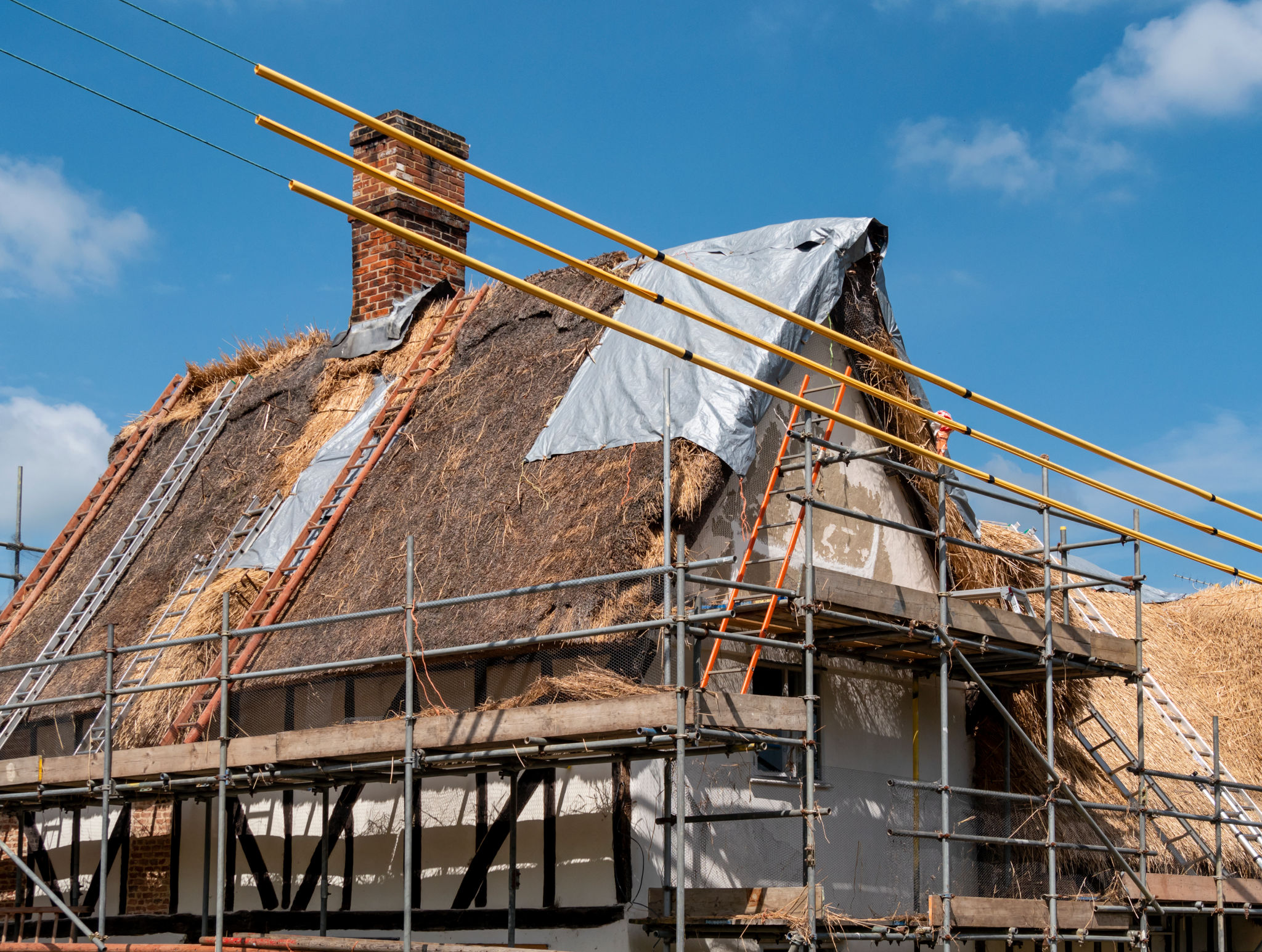 Re-thatching an old house in Suffolk Re-thatching an old house in Suffolk