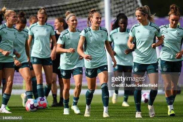 Sophia Kleinherne of Germany warms up with teammates during the UEFA Women's Euro 2022 Germany Training Session at Brentford Community Stadium on...