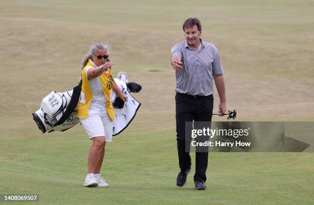 Sir Nick Faldo of England walks down the 18th during the Celebration of Champions Challenge during a practice round prior to The 150th Open at St...