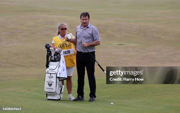 Sir Nick Faldo of England and Caddie Fanny Sunesson on the 18th during the Celebration of Champions Challenge during a practice round prior to The...