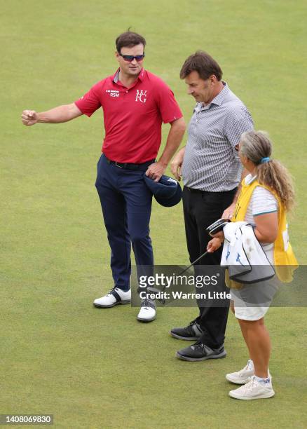 Sir Nick Faldo of England and Caddie Fanny Sunesson talks to Zack Johnson of The United States on the 18th during the Celebration of Champions...