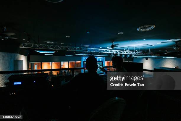 asian esports event crew working at backstage with control panel on stage lighting , sound system and lighting effect - broadcast control room stock pictures, royalty-free photos & images