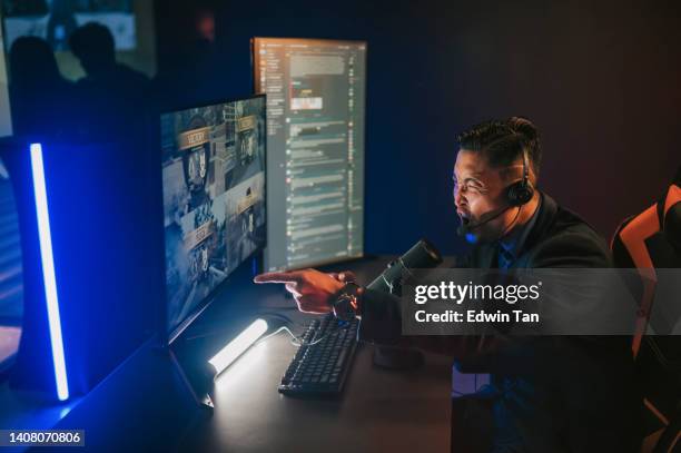 excited asian chinese esports game host streamer cheering for victory online live streaming hosting in game room with voip and instant messaging social platform. - compere stock pictures, royalty-free photos & images
