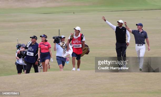 Tigers Woods of The United States and Rory McIlroy of Northern Ireland interact with the crowd on the 18th during the Celebration of Champions...