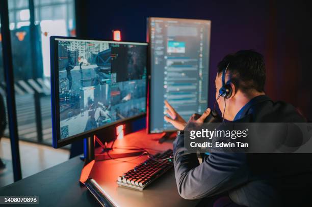 excited asian chinese esports game host streamer online live streaming hosting in game room with voip and instant messaging social platform. - gaming station stock pictures, royalty-free photos & images