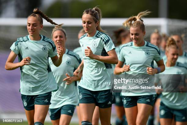 Sophia Kleinherne and Kathrin-Julia Hendrich of Germany warm up during the UEFA Women's Euro 2022 Germany Training Session at Brentford Community...
