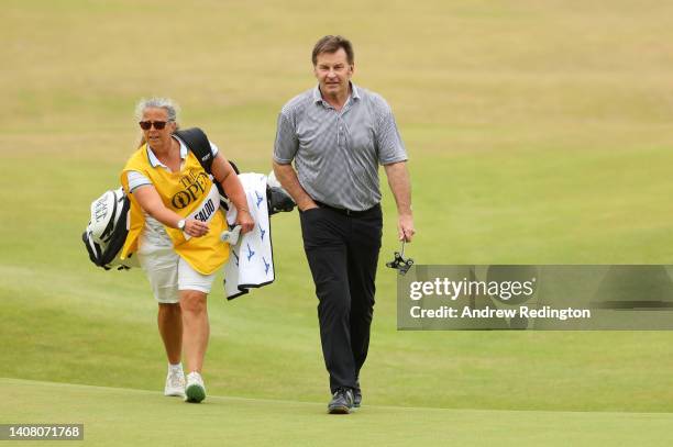 Sir Nick Faldo of England and Caddie Fanny Sunesson on the 18th during the Celebration of Champions Challenge during a practice round prior to The...