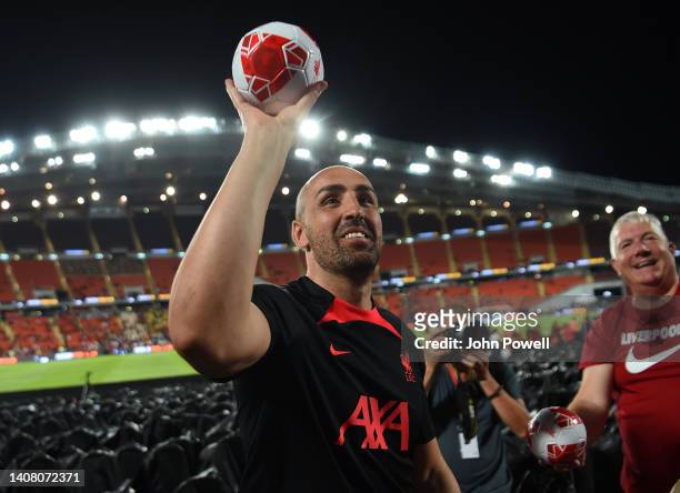 Jose Enrique ex Liverpool player throws balls into the crowd at the end of an open training session in the Rajamagala National Stadium on July 11,...