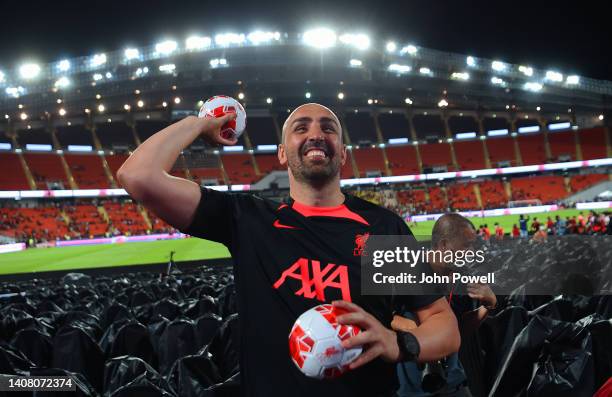 Jose Enrique ex Liverpool player throws balls into the crowd at the end of an open training session in the Rajamagala National Stadium on July 11,...