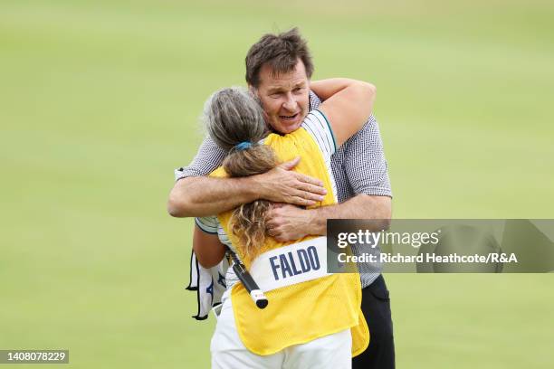 Sir Nick Faldo of England and caddie Fanny Sunesson embrace during the Celebration of Champions prior to The 150th Open at St Andrews Old Course on...