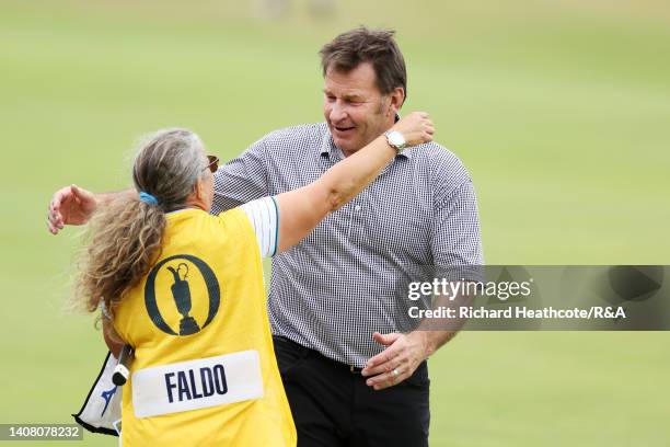 Sir Nick Faldo of England and caddie Fanny Sunesson embrace during the Celebration of Champions prior to The 150th Open at St Andrews Old Course on...