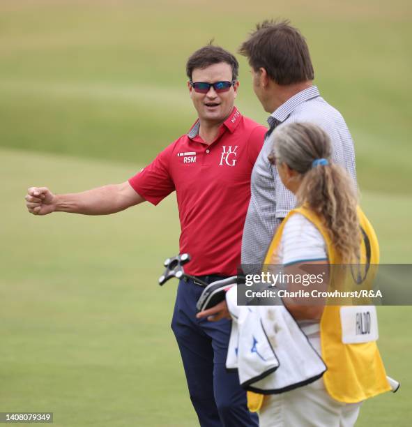 Zach Johnson of the United States talks to Sir Nick Faldo of England and his caddie Fanny Sunesson during the Celebration of Champions prior to The...