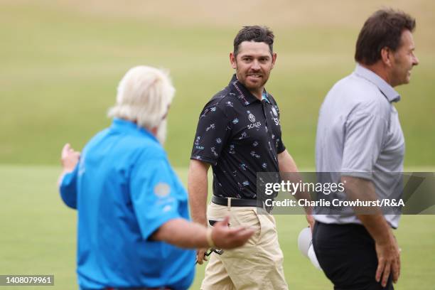 John Daly of the United States, Louis Oosthuizen of South Africa and Sir Nick Faldo of England walk on the 18th green during the Celebration of...