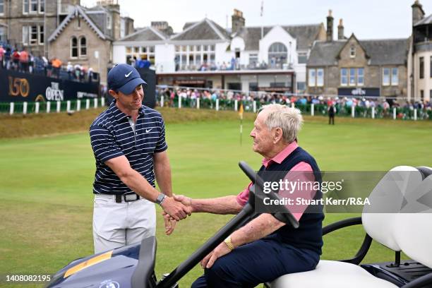 Rory McIlroy of Northern Ireland shakes hands with Jack Nicklaus of the United States during the Celebration of Champions prior to The 150th Open at...