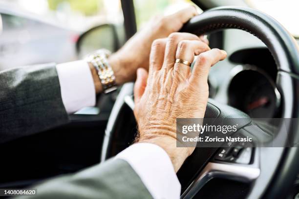 businessman driving a car pushing car horn - horn press stock pictures, royalty-free photos & images