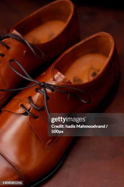 close-up of shoes on table - brown shoe bildbanksfoton och bilder
